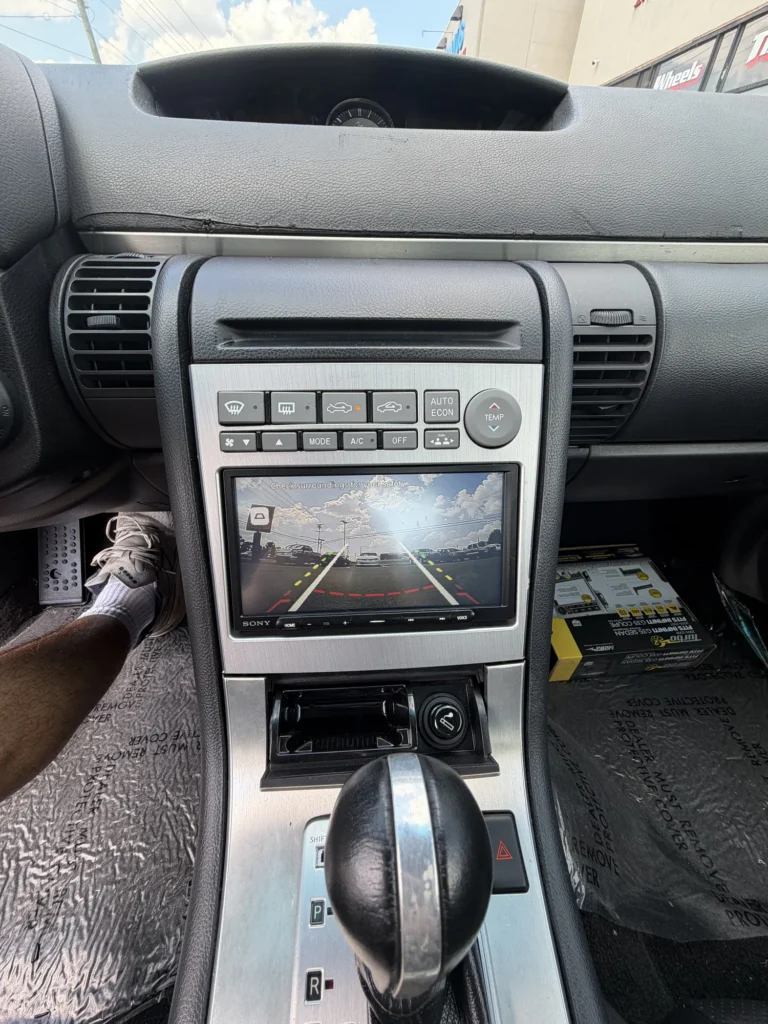 Backup camera display installed in a vehicle dashboard.