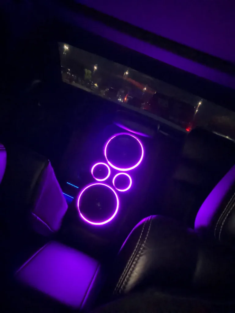 Purple LED lighting around an installed vehicle audio system.