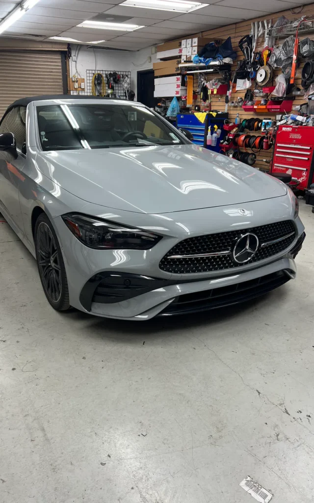 White Mercedes coupe inside the Mega Sound installation bay.