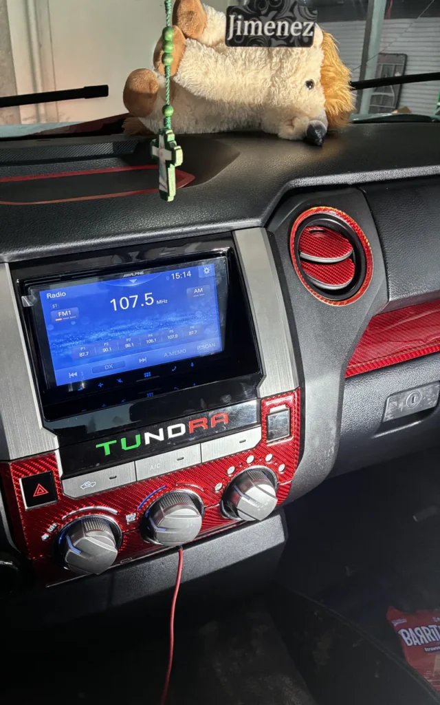 Aftermarket head unit installed in a Toyota Tundra dashboard.